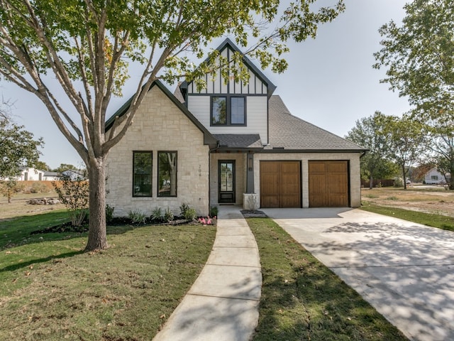 view of front facade with a front lawn and a garage