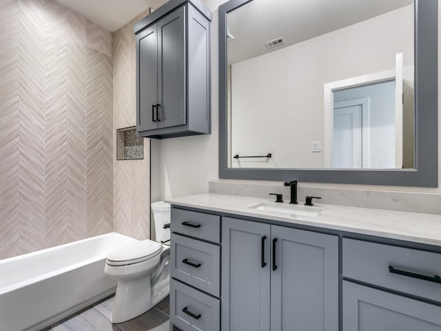 full bathroom featuring vanity, toilet, and shower / bath combination