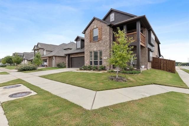 view of front of house with a balcony, a front yard, and a garage