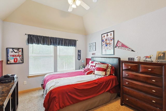 bedroom with lofted ceiling, light colored carpet, and ceiling fan