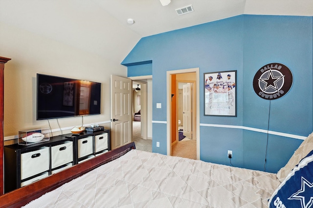 carpeted bedroom featuring lofted ceiling