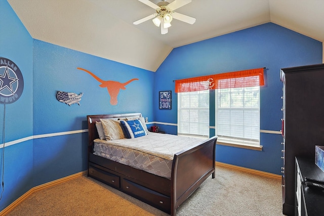 carpeted bedroom with vaulted ceiling and ceiling fan