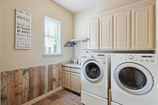 laundry area featuring cabinets and washer and clothes dryer