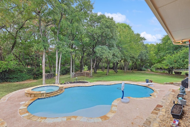 view of swimming pool featuring a diving board, an in ground hot tub, a lawn, and a patio area