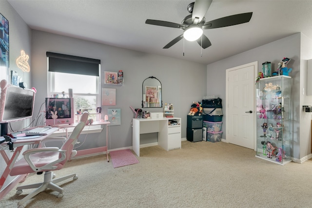 office area with light colored carpet and ceiling fan