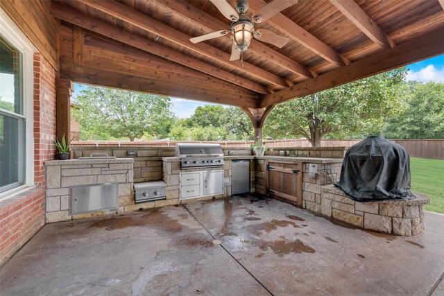 view of patio with exterior kitchen, ceiling fan, and area for grilling