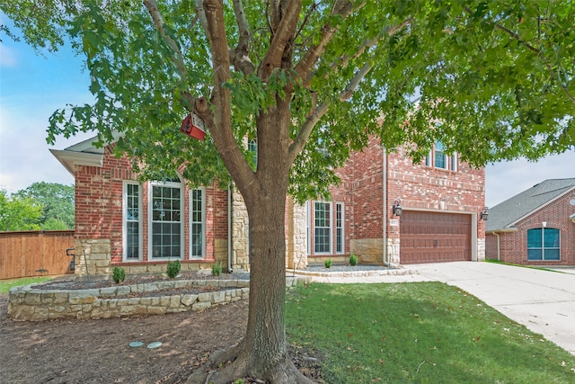 view of front facade with a garage and a front yard