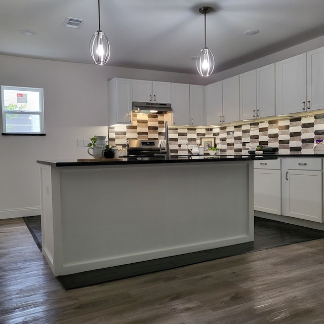 kitchen with dark wood-type flooring, decorative light fixtures, white cabinets, and decorative backsplash