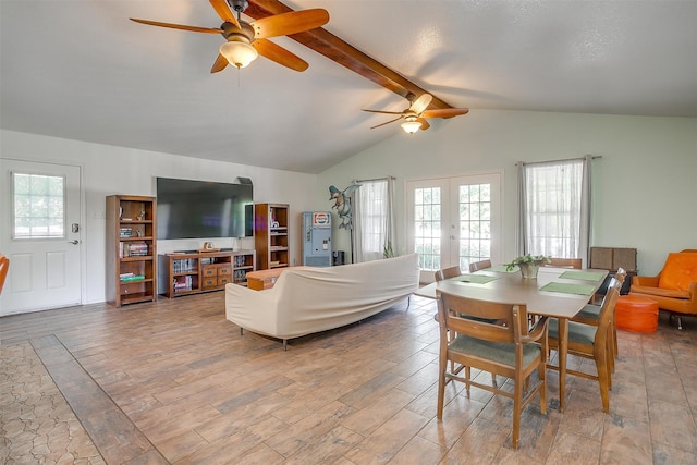 dining room featuring french doors, lofted ceiling with beams, light hardwood / wood-style floors, and ceiling fan