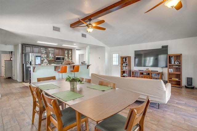 dining room with vaulted ceiling with beams and ceiling fan