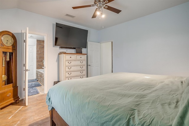 bedroom featuring ensuite bath, ceiling fan, and light hardwood / wood-style floors