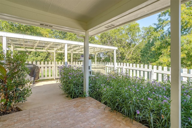 view of patio featuring a grill