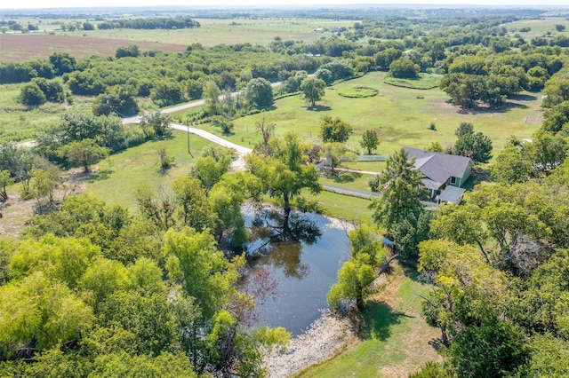 drone / aerial view featuring a rural view and a water view