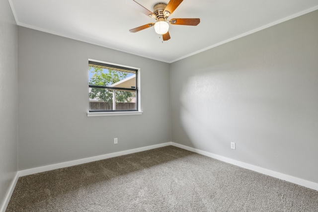 carpeted empty room featuring crown molding and ceiling fan