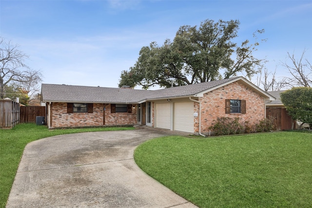 single story home with central AC unit, a garage, and a front yard