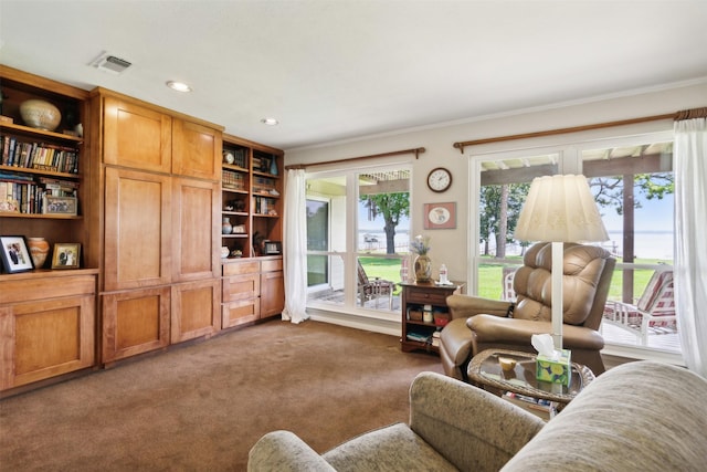 living room with carpet floors and ornamental molding