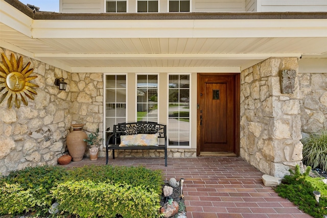 property entrance featuring covered porch