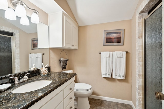 bathroom featuring toilet, vanity, vaulted ceiling, and walk in shower