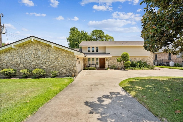 view of property featuring a front yard