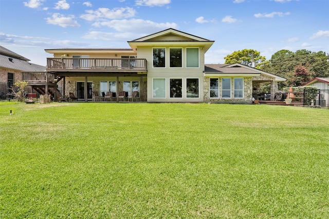 124 N Broadway Rd, Azle, TX 76020 - back of house featuring a deck, fence, a yard, and stone siding
