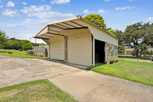 view of outbuilding with a lawn