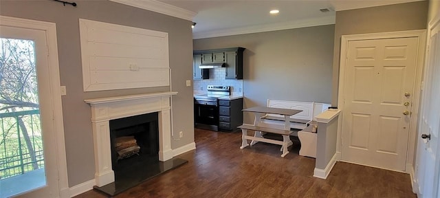 home office featuring ornamental molding, dark wood-type flooring, and a healthy amount of sunlight