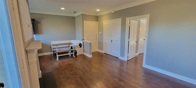 interior space with crown molding and dark hardwood / wood-style floors