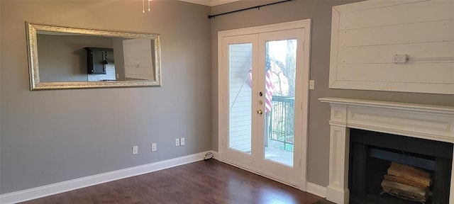 doorway to outside featuring plenty of natural light, dark hardwood / wood-style floors, and french doors