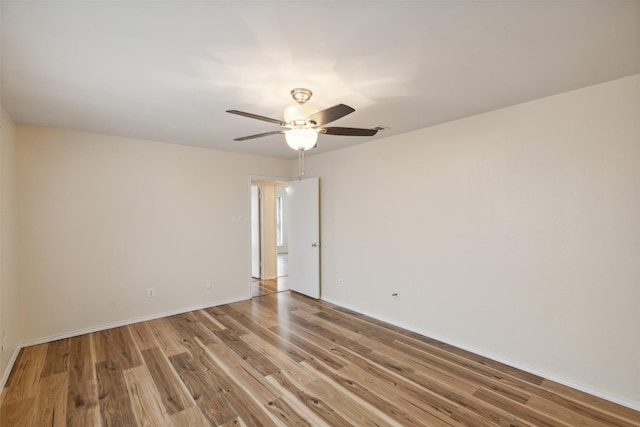 empty room with wood-type flooring and ceiling fan