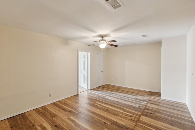 unfurnished room with ceiling fan and light wood-type flooring