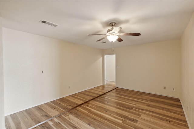 unfurnished room featuring hardwood / wood-style flooring and ceiling fan