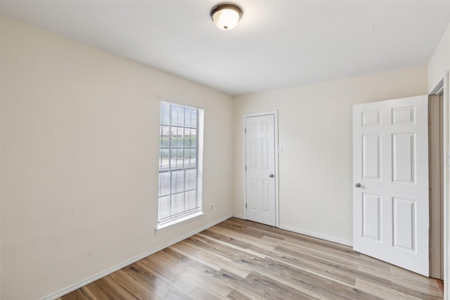 spare room featuring light hardwood / wood-style flooring