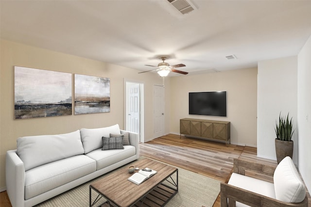 living room with ceiling fan and light wood-type flooring