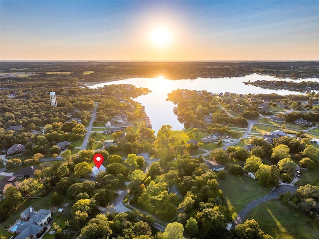 aerial view at dusk with a water view