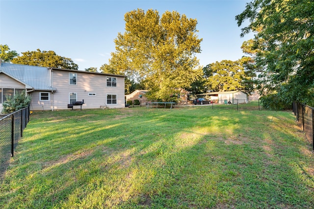 view of yard with a trampoline