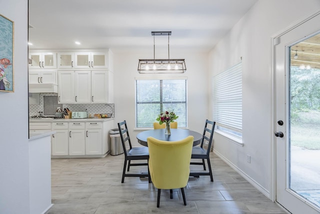 dining room featuring baseboards