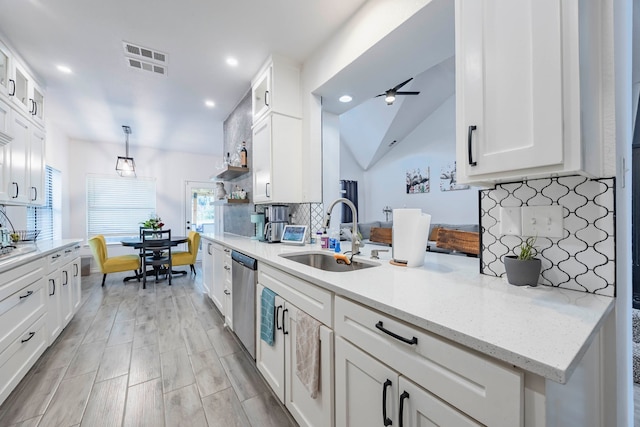 kitchen with white cabinets, dishwasher, sink, ceiling fan, and pendant lighting