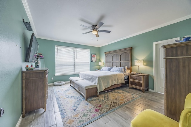 bedroom with baseboards, wood tiled floor, a ceiling fan, and crown molding