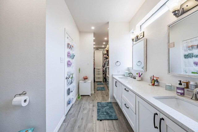 bathroom featuring vanity and hardwood / wood-style flooring