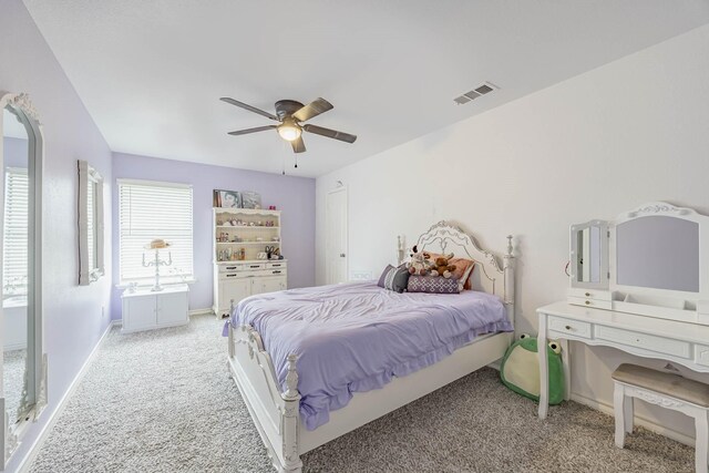 bedroom with carpet, baseboards, visible vents, and ceiling fan