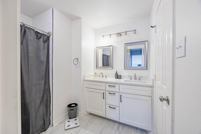 bathroom with vanity and walk in shower