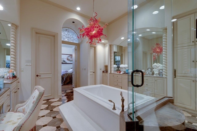 bathroom with vanity, separate shower and tub, and crown molding