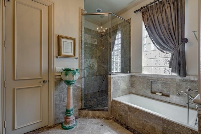 bathroom featuring separate shower and tub, a notable chandelier, and ornamental molding