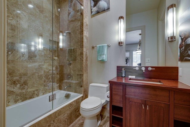 full bathroom featuring vanity, toilet, and tiled shower / bath