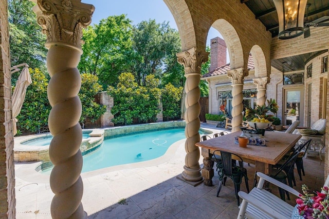 view of pool featuring a patio and an outdoor fireplace