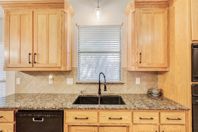 kitchen featuring black dishwasher, light brown cabinetry, stone countertops, and sink