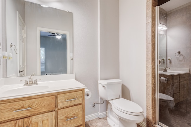 bathroom featuring vanity, toilet, tile patterned flooring, and a shower with door