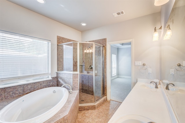 bathroom featuring vanity, a wealth of natural light, and shower with separate bathtub