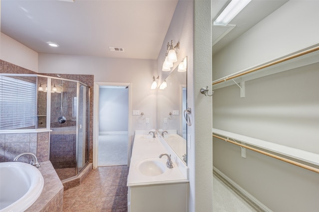 bathroom featuring vanity, independent shower and bath, and tile patterned floors