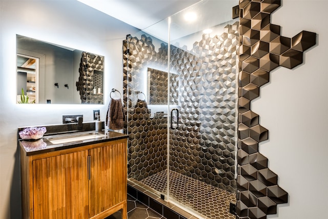 bathroom with vanity, tile patterned floors, and an enclosed shower